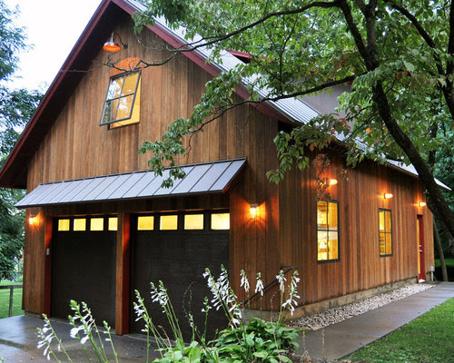Large rustic detached two-car garage workshop idea in Louisville