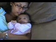 Ava playing while mommy is sleeping