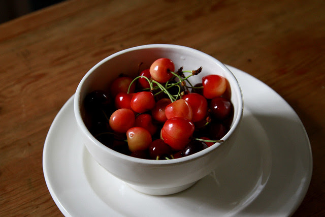 cherries in a white bowl