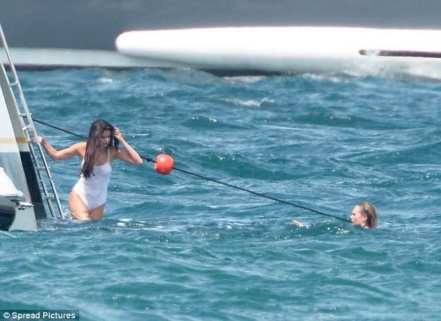 Letting go: After kicking around for a while, the Undercover singer finally threw caution to the wind and got into the water as her pal looked on to make sure she was safe