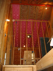 A stud wall awaits sheetrock.