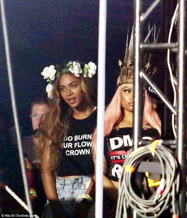 Awkward: The atmosphere between Nicki Minaj and Beyonce was decidedly frosty as they stood together on the side of the Coachella stage on Sunday to watch Drake perform