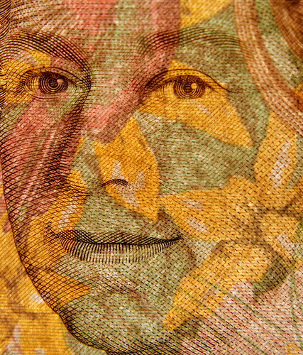 Famous tattoo 10 10 pound note held against the light