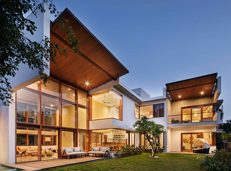 This L-Shaped Home's Double Height Living Room Opens To ...