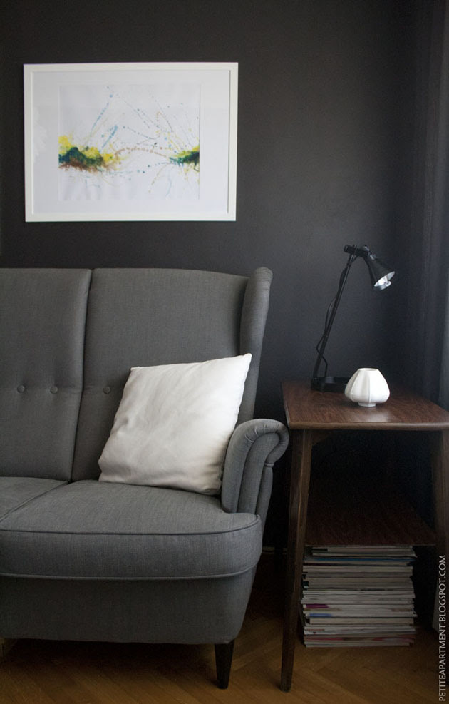 dark grey black living room with grey ikea strandmon sofa mid century modern
