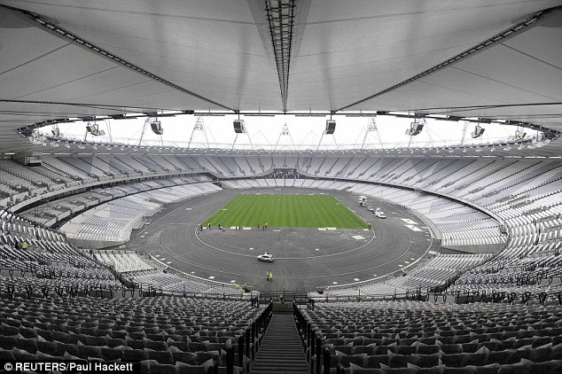 Home time: The Olympic Stadium is seen after the last piece of turf is laid on its field of play