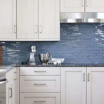 white kitchen cabinets blue glass backsplash design ideas