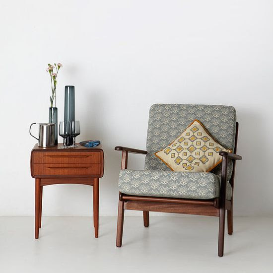Prettily-patterned fabric by Skinny LaMinx fits right in with the clean lines of this mid-century chair.