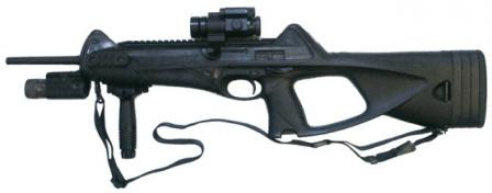 Beretta CX4 Storm carbine accessorized with optional Picatinny rails, forward grip, red-dot sight and tactical light.