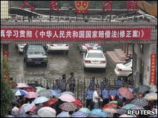 People outside Lingling District People's Court in Yongzhou,  Hunan, China (1 June 2010)