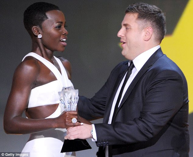 Overwhelmed: The stunning actress had to catch her breath before Jonah Hill handed her the trophy