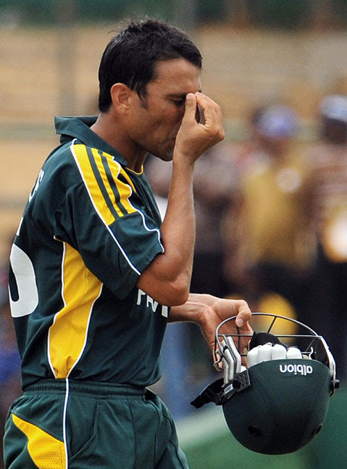 Younis Khan walks back after a 73-ball 23