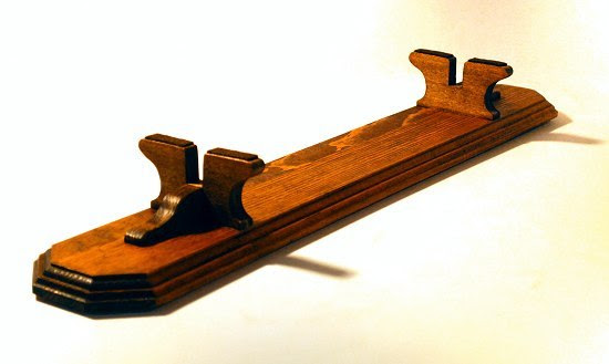 Custom model stand created for a large antique flat-bottom boat model.