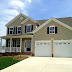 Beige House Black Shutters Blue Door - Your exterior entryway sets the tone for your entire home.