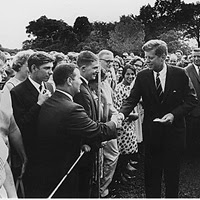 President John F. Kennedy greeting Peace Corps Volunteers