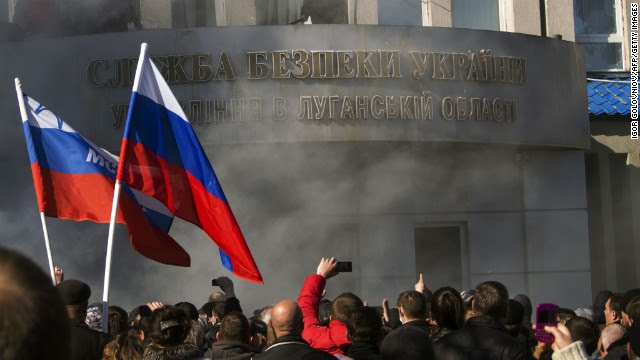 Pro-Russian activists hold a rally in front of a Ukrainian Security Service office in Luhansk on April 6. 