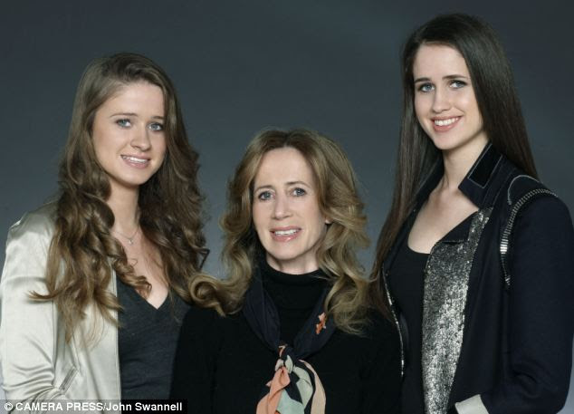 Battle: Michelle Young, here with daughters Sasha and Scarlet, claims she is doing this for women's rights 