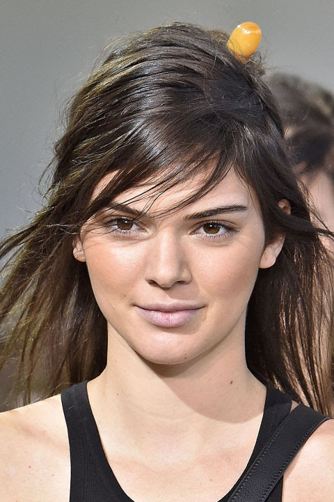Models including Kendall Jenner (pictured) showcased a fresh and radiant glow here. "The look is about bronze, matte skin. A believable warmth is created with Michael Kors Bronzer in Glow, a universal shade," said makeup artist Dick Page. We want it!

