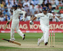 Sachin Tendulkar drops his bat while scrambling to the crease to avoid being run out