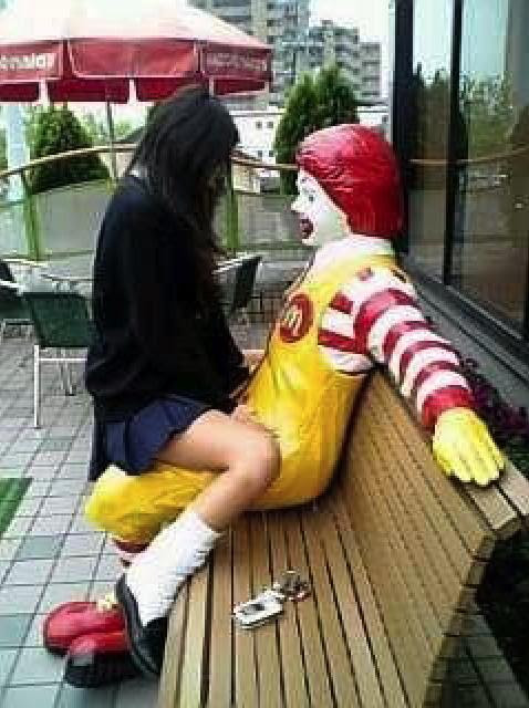 Japanese Girl riding Ronald McDonald and Luvin' It