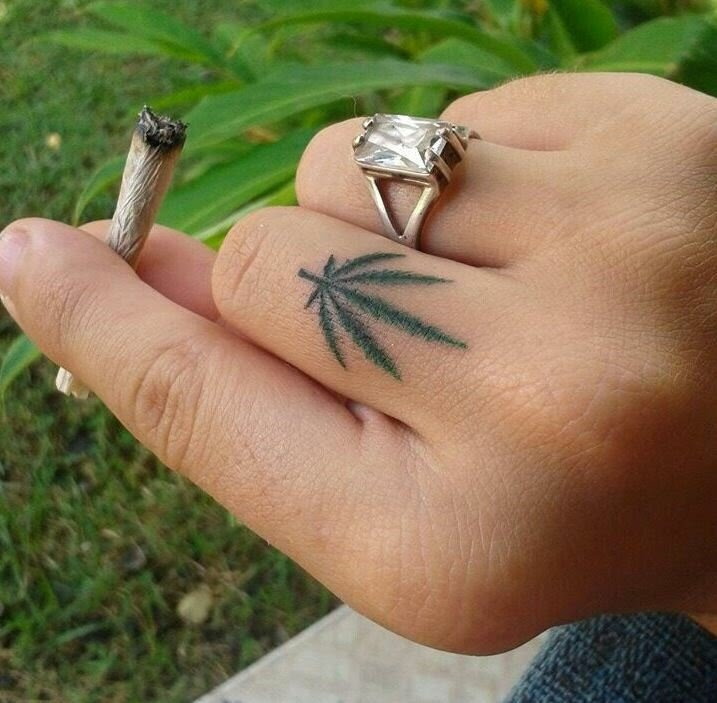 Cannabis leaf finger tattoo 23