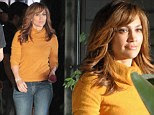 Dangerous curves! Jennifer Lopez shows off figure in form fitting yellow sweater while filming new thriller The Boy Next Door