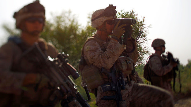 Marine Lt. Jeffrey Smith with Golf Company of the 2nd Battalion, 8th Regiment, on a patrol with Afghan forces  through a harvested poppy field in northern Marjah, Helmand province, Afghanistan.