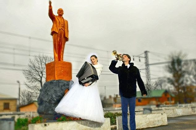 Lenin me your ears: This couple were desperate to trumpet their union from under the statue of their favourite revolutionary