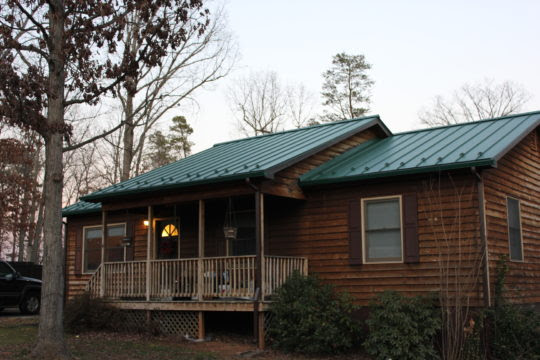 House with Snow Birds on a metal Roof