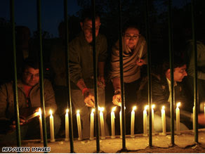 People in New Delhi, India, take part in a candlelight vigil for the victims of the Mumbai attacks on Sunday.