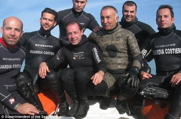 Professor Sebastiano Tusa, centre, and his team of divers discovered the metal ignots of what they believe to be the mythical metal of orichalcum on a 2,600-year-old shipwreck found off the coast of Gela in Sicily