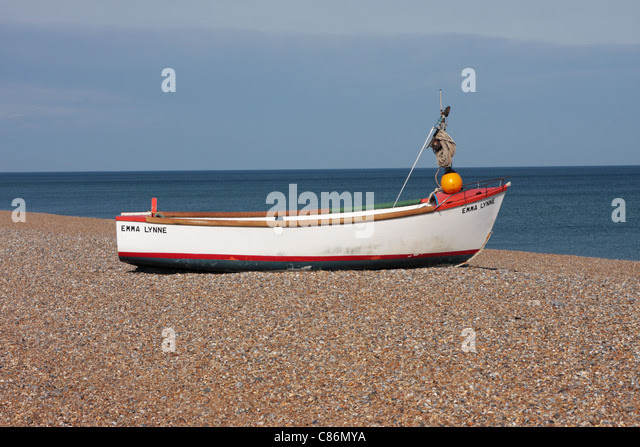 Small Boat On Pebble Beach Stock Photos &amp; Small Boat On ...