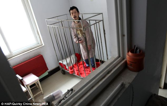 Peng Weiqing, 48, has been in the cage in his mother's home in the city of Zhengzhou, capital of central China's Henan Province, since the age of six