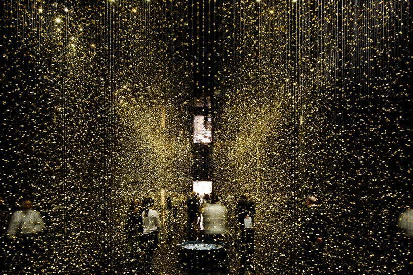 the installation consists of 80,000 glittering watch base-plates