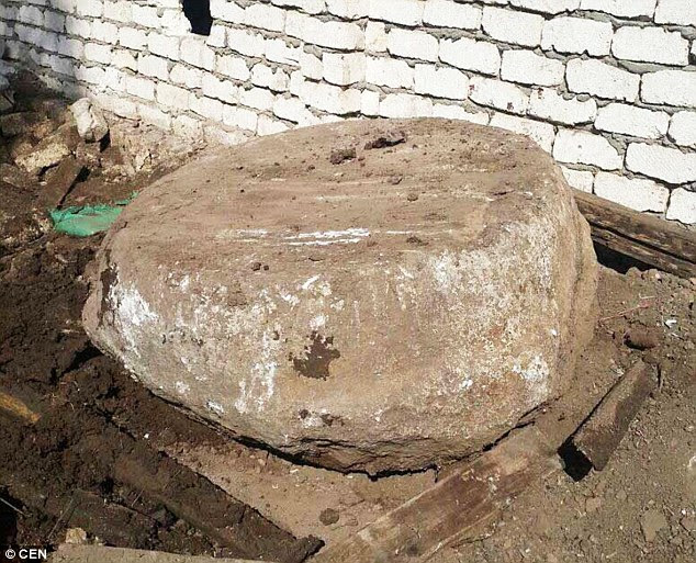 The base of a column found on the site is pictured. Egyptian police said seven men reportedly started digging in the garden of the Al-Badrashin property two weeks ago, but ran into problems when the hole started to fill with water. This led to neighbours calling the police, who raided the property and arrested the group