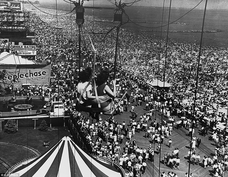 This breathtaking snap of Coney Island in 1950 shows the amusement park, once the biggest in the country, in its full glory as crowds almost completely cover the boardwalk and sand