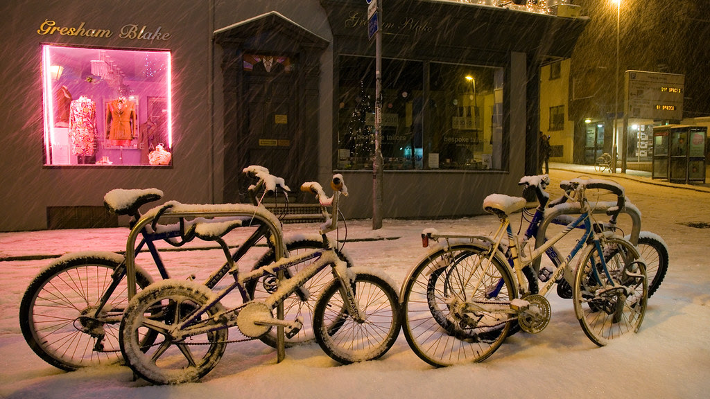 Snow-covered bicycles in Brighton