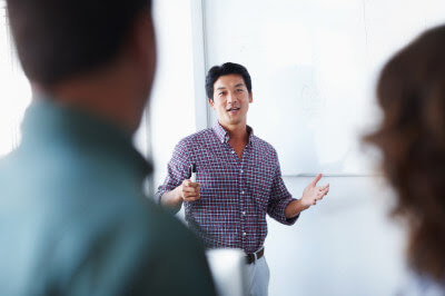 man leading meeting