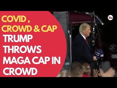 Trump throws MAGA cap in crowd before announcing he had COVID-19 | COVID...