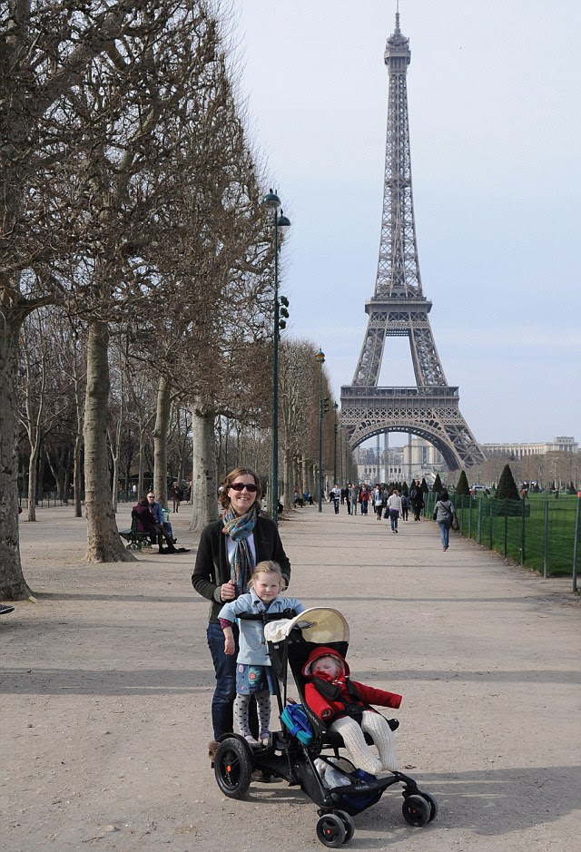 Paris on four wheels: Liz, Catherine and Hannah stroll towards the Eiffel Tower