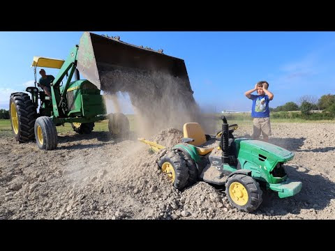 Playing in the dirt with tractors to stop water and mud | Tractors for kids