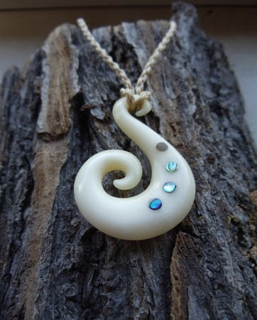 Koru, Traditional hand carved tribal bone pendant and necklace.