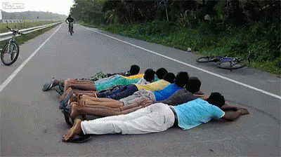 guy jumps people on a bike and goes over the handle bars