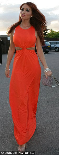Subdued: The beautician's dazzling dress made her usually perma-tanned skin look pale
