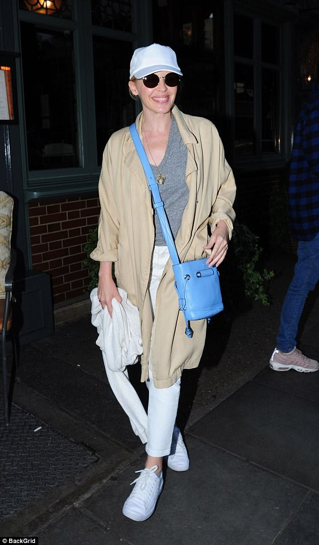 Low-key: Kylie Minogue was enjoying a solo night out in London on Saturday, stepping out in an uncharacteristically casual ensemble as she dined at the Ivy Chelsea Gardens in London