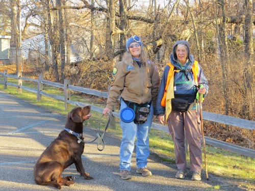 hikers with chocolate lab