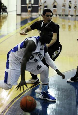 Ozen player Jordan Hunter, #23, drives to the goal during the Ozen High School boys basketball game against Nederland High School on Tuesday, February 5, 2013, at Ozen High School.  Nederland won over Ozen 50 - 45.
Photo taken:
Randy Edwards/The Enterprise