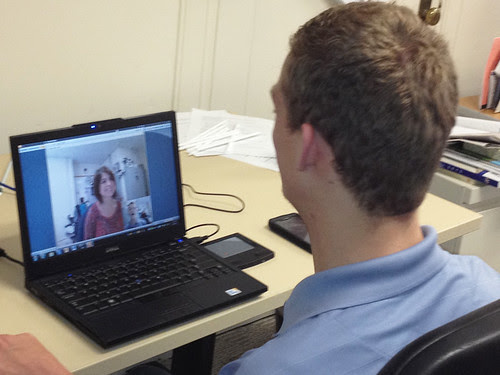 Daman Wandke, Virtual Intern, communicates with Dora Flores.  Wandke came to USDA Headquarters in Washington D.C. and stayed with the agency as a virtual intern while seeking a degree in Management Information Systems from Western Washington University in Bellingham, WA.  