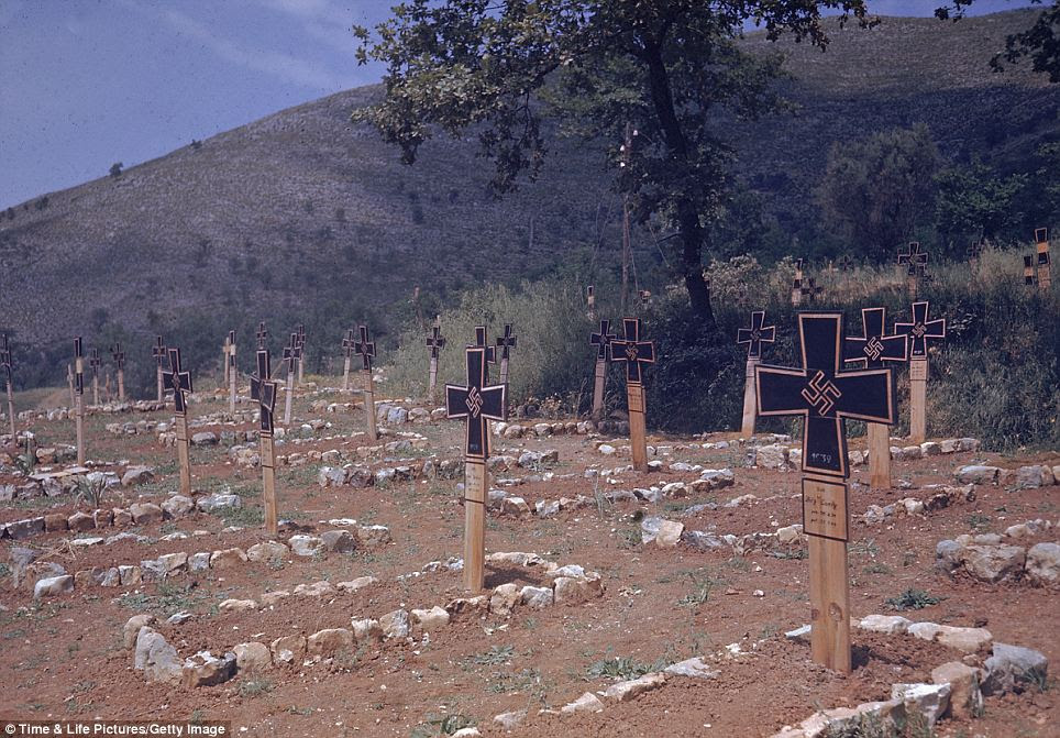 End of the road: A German grave yard crops up along Italy's Esperia Pico Road. The photographs were taken as troops marched to Rome by photojournalist Carl Mydans