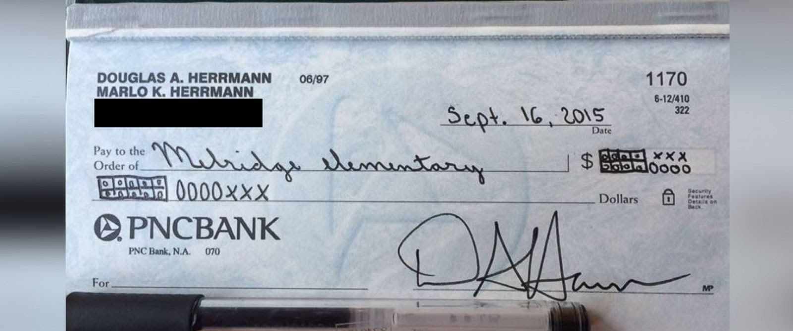 PHOTO: Doug Herrmann wrote a check to his sons school using the common core teaching strategy. 